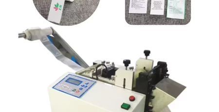 this is an automatic label cutting machine with electronic eye for accurate location cut in clothing manufacturing industries.